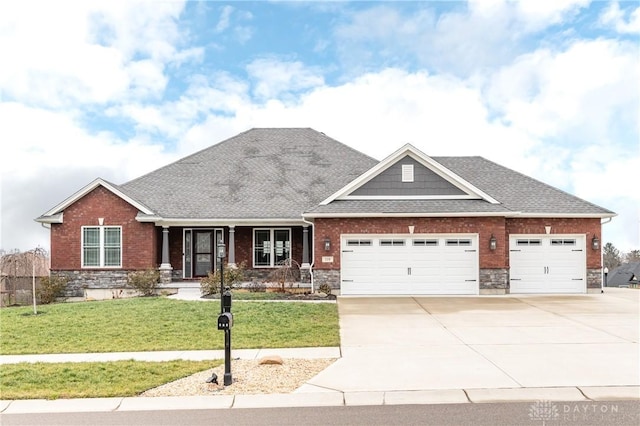 craftsman-style home with a front yard and a garage