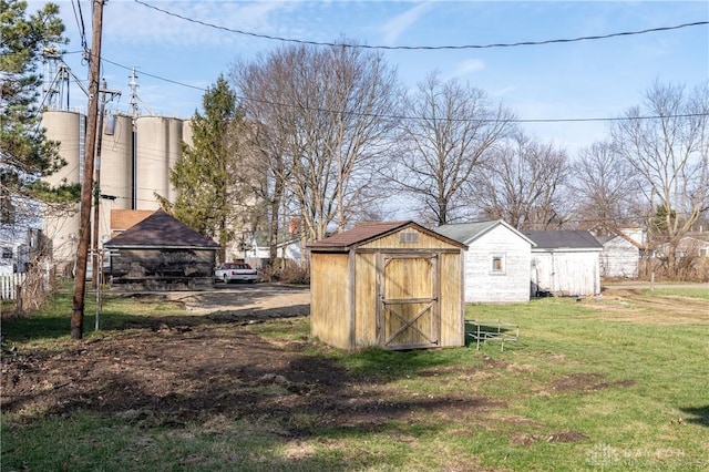 view of outbuilding featuring a lawn