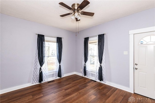 foyer with hardwood / wood-style floors and ceiling fan