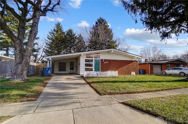 ranch-style home with a front lawn and a carport