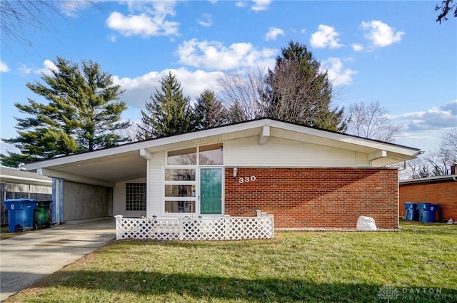 view of front of house with a front lawn and a carport