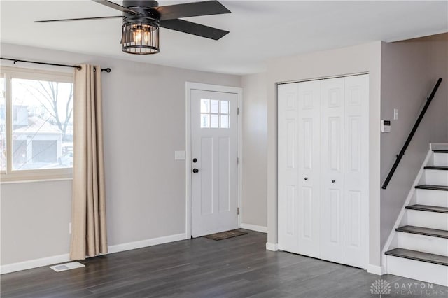 foyer entrance with ceiling fan and dark hardwood / wood-style floors