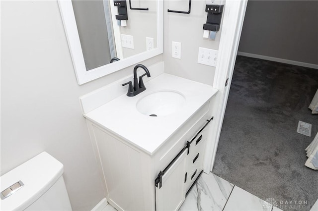 bathroom with vanity and toilet