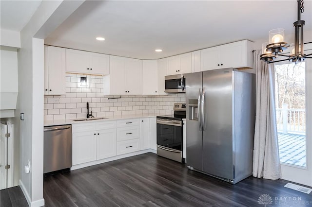 kitchen with white cabinetry, sink, and appliances with stainless steel finishes