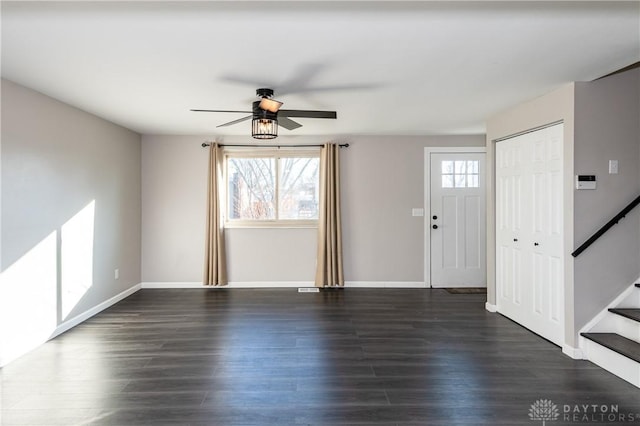 interior space featuring ceiling fan and dark wood-type flooring