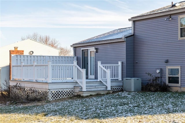 back of property featuring central AC and a deck