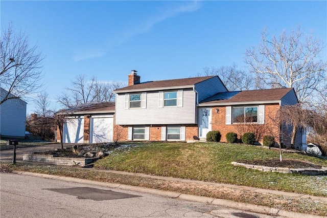 tri-level home with a front yard