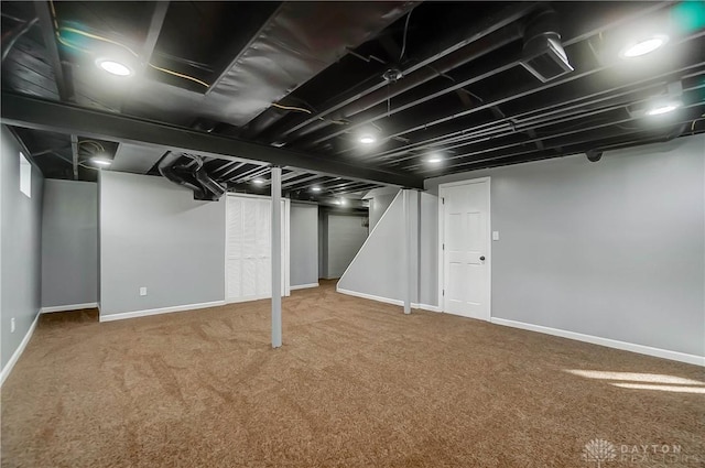 basement featuring carpet flooring