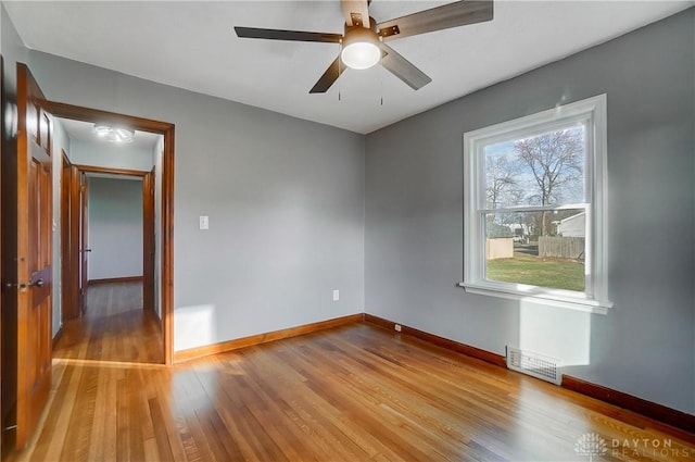 spare room featuring ceiling fan and light hardwood / wood-style floors