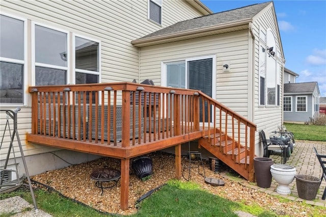 wooden terrace featuring a patio