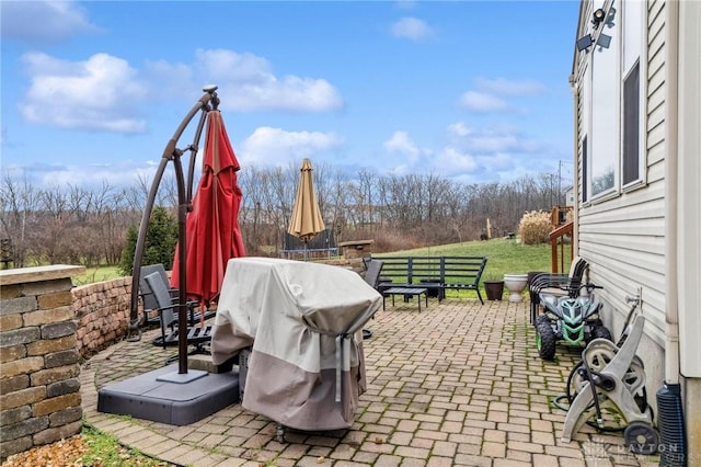 view of patio featuring a grill