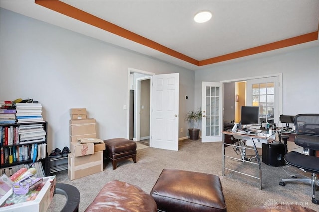 carpeted office featuring french doors