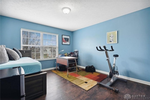 office with dark hardwood / wood-style flooring and a textured ceiling