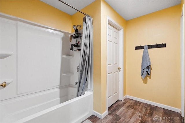 bathroom featuring shower / bath combination with curtain and wood-type flooring