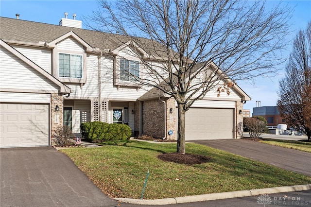 view of front facade featuring a front yard and a garage