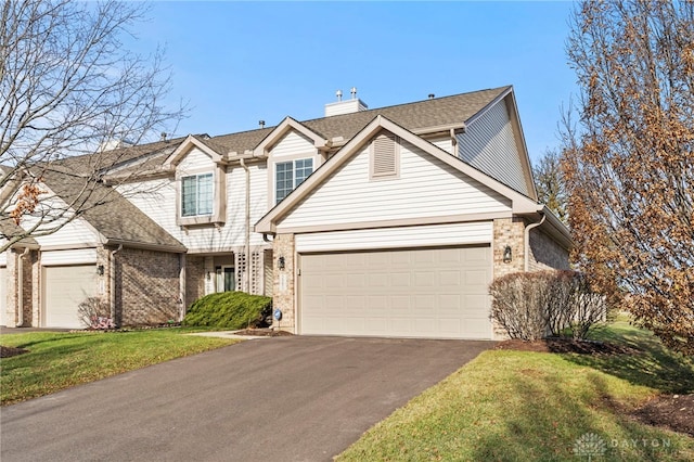 view of front property with a garage and a front lawn