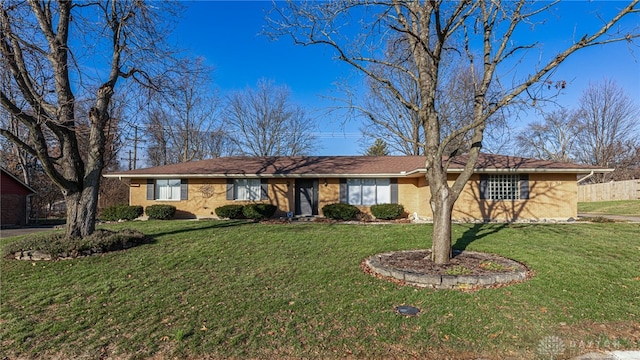 single story home featuring a front lawn