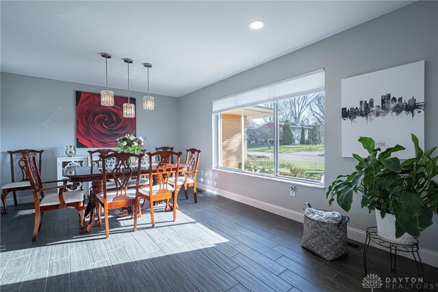 dining area with wood tiled floor, visible vents, baseboards, and recessed lighting