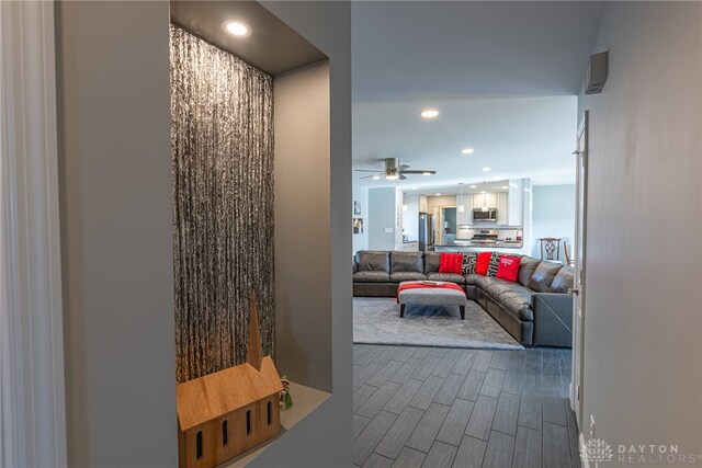 hallway with wood tiled floor and recessed lighting