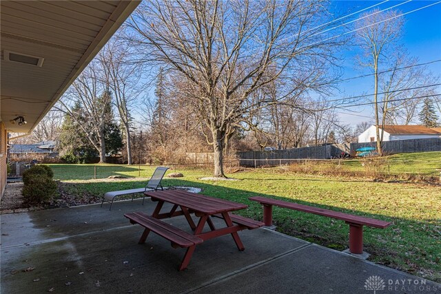 view of yard with fence and a patio