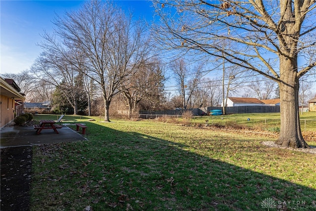 view of yard featuring a patio area and fence