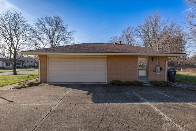 garage with concrete driveway