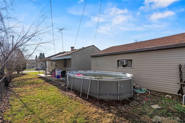 rear view of property featuring a wall mounted air conditioner