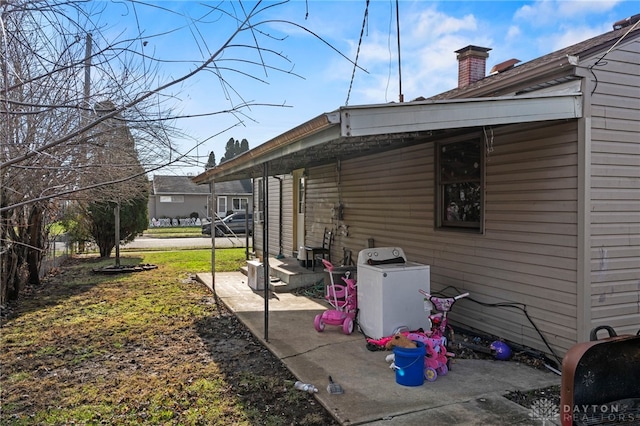 exterior space with a patio area and washer / dryer