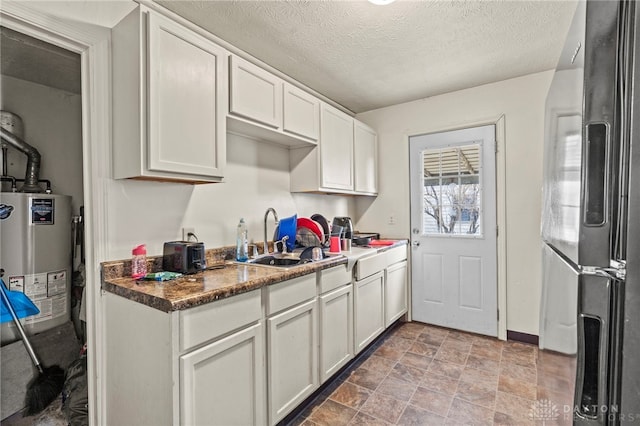 kitchen with stainless steel fridge with ice dispenser, white cabinetry, sink, and water heater