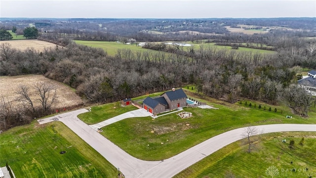 birds eye view of property with a rural view