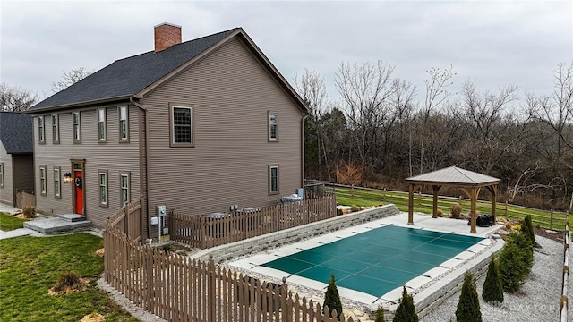 view of swimming pool with a gazebo