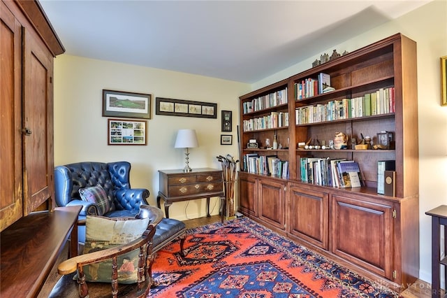 sitting room with hardwood / wood-style flooring