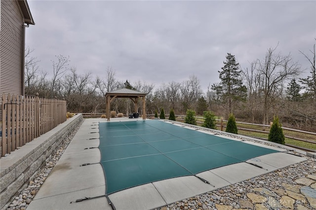 view of swimming pool featuring a gazebo