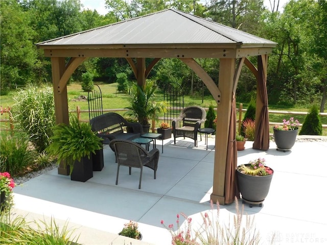 view of patio featuring an outdoor living space and a gazebo