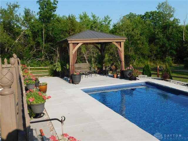 view of pool with a gazebo and a patio