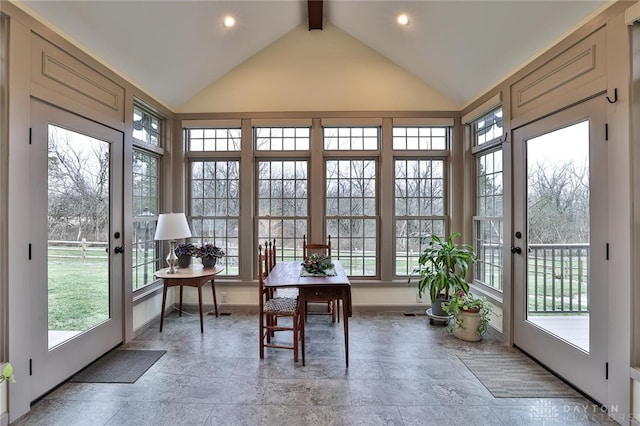 sunroom with lofted ceiling with beams