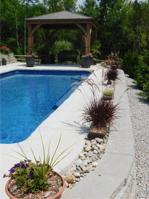 view of swimming pool featuring a gazebo