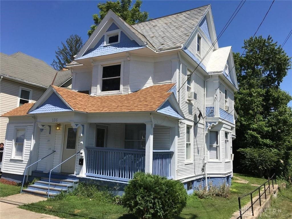 136 N Spring St, Wilmington, OH 45177 - victorian house featuring covered porch and a shingled roof