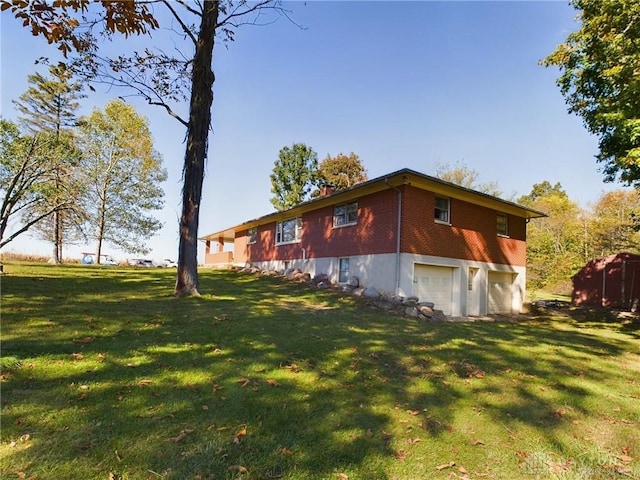 view of property exterior featuring a garage and a lawn