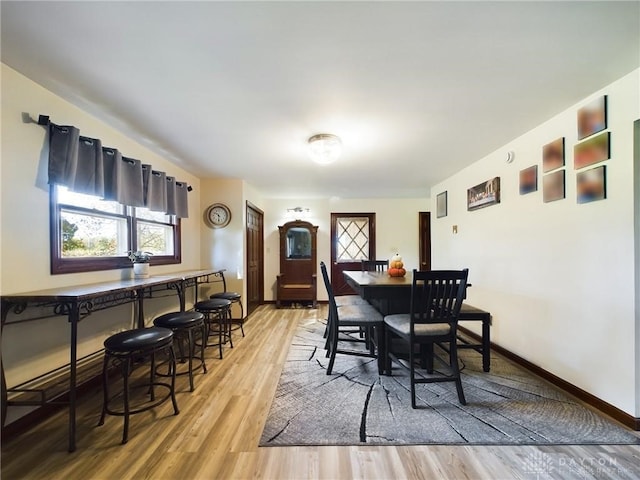 dining area featuring light wood-type flooring