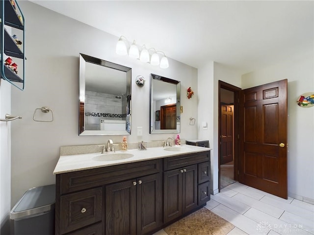 bathroom featuring tile patterned flooring and vanity