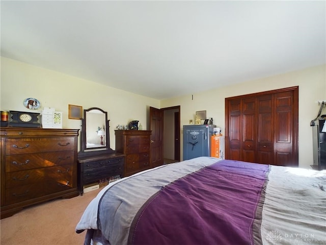 carpeted bedroom featuring a closet