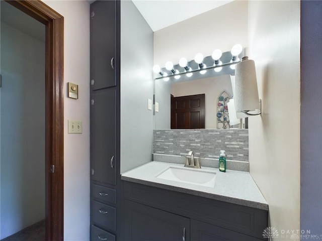 bathroom featuring decorative backsplash and vanity