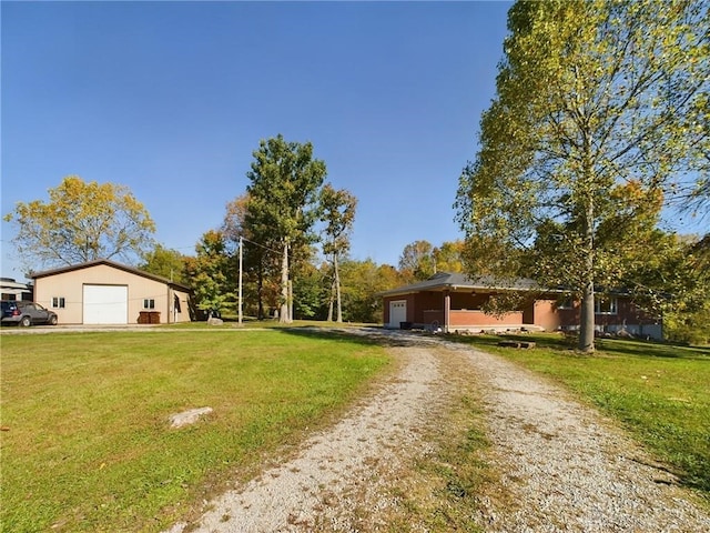 view of front facade with a garage and a front lawn