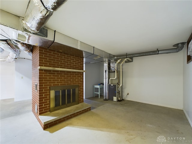 basement with heating unit and a fireplace