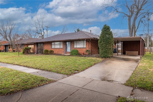 ranch-style house with a carport and a front yard