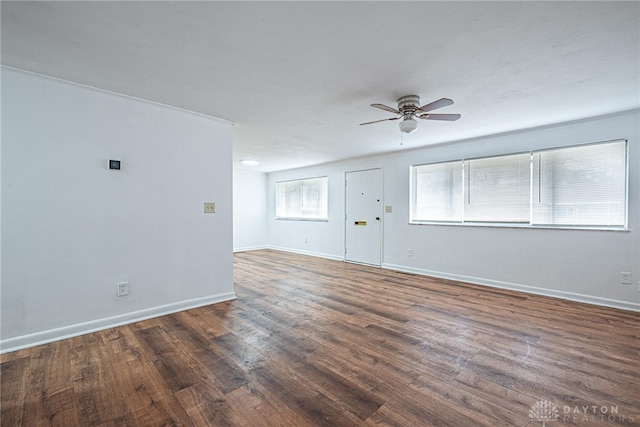 empty room featuring dark hardwood / wood-style floors and ceiling fan