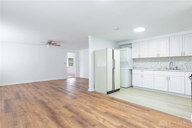 kitchen featuring white cabinetry and backsplash