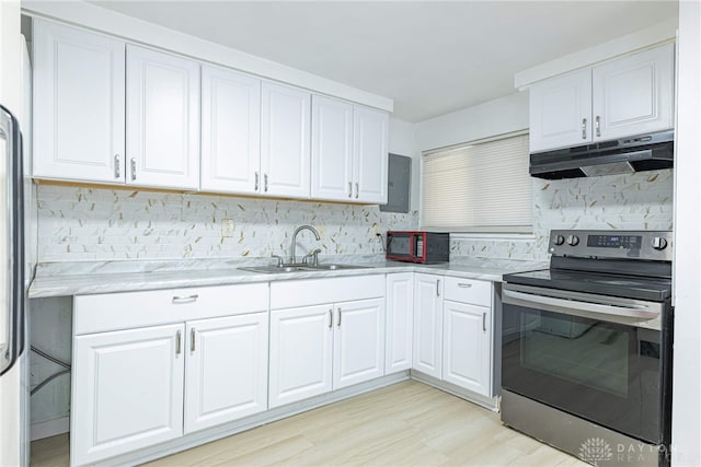 kitchen featuring decorative backsplash, sink, white cabinetry, and stainless steel electric range