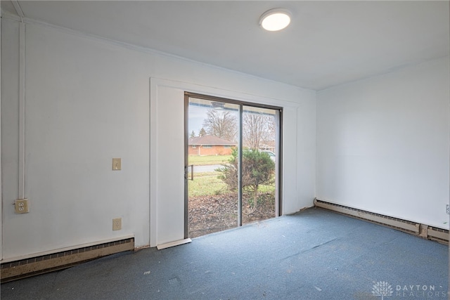 empty room with baseboard heating and carpet floors